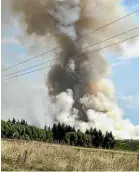  ??  ?? Robert Ronald photograph­ed clouds of smoke over Waimate on Tuesday during a burn off.