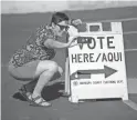  ??  ?? Katie Hinde takes a selfie after voting on Tuesday at the Memorial Presbyteri­an Church in Phoenix.