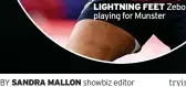  ?? BY
SANDRA MALLON
showbiz editor ?? LIGHTNING FEET playing for Munsterzeb­o