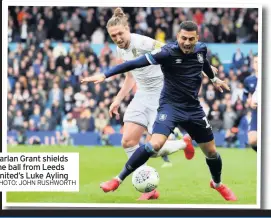  ??  ?? Karlan Grant shields the ball from Leeds United’s Luke Ayling PHOTO: JOHN RUSHWORTH