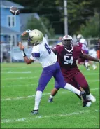  ?? Photo by Ernest A. Brown ?? St. Raphael receiver Andre Gray (8) hauls in a touchdown pass to help the Saints defeat Woonsocket, 23-7, Saturday afternoon.