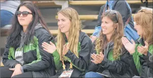  ??  ?? Members of the Team P.E.I. athletics squad, from left, Constance Gilman, Kylee Wallace, Madison Dayton and Bailey Smith cheer for the Island’s softball team Wednesday at the Canada Games.