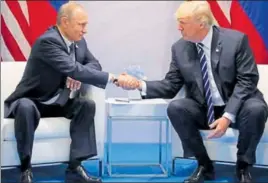  ?? AFP ?? US President Donald Trump and Russian President Vladimir Putin meet at the G20 summit.