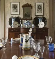  ??  ?? LEFT (above) The dining room is in the original, oldest part of the Colonial house. (below) In what’s now the dining room, a sideboard stands at the location of the cooking hearth for the original house.