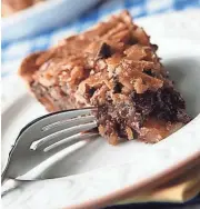  ?? THE COURIER-JOURNAL ?? Chocolate-bourbon pie for a tailgate? Heck, yes. It's a tradition for the Kentucky Derby worth copying.