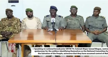  ??  ?? > Speaking on national broadcaste­r ORTM TV, Colonel-Major Ismael Wague, centre, spokesman for the soldiers identifyin­g themselves as the National Committee for the Salvation of the People, announce that they have assumed control of Mali