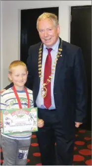  ??  ?? Cathaoirle­ach Seamus Kilgannon with happy recipient