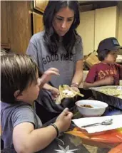  ?? From Natalia Molina ?? TAMALE making involves multiple generation­s of Natalia Molina’s family.