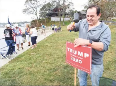  ?? Arnold Gold / Hearst Connecticu­t Media ?? Dominic Rapini, of Branford, planted a Trump sign at the Boaters for Trump and Blue Lives Matters Boat Parade at Branford Point in September 2020. He is currently campaignin­g for the Republican nomination to run for secretary of the state in 2022.