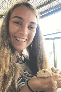  ??  ?? NEW FRIENDS: Sophie Kalkowski-Pope meets a lizard during the National Youth Science Forum in Canberra.