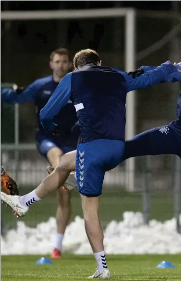  ??  ?? Nikola Katic trains with Rangers team-mates on a practice pitch as Rapid Vienna tried to preserve their playing surface ahead of tonight’s clash in Austria