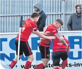  ??  ?? Neil Gauld is mobbed after netting Inverurie’s winner