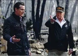  ?? EVAN VUCCI — THE ASSOCIATED PRESS ?? President Donald Trump talks with then-california Gov.-elect Gavin Newsom during a visit to a neighborho­od affected by the wildfires in Paradise in 2018.