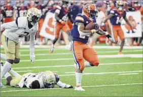  ?? Dennis Nett / The Post-standard via AP ?? Syracuse running back Sean Tucker runs for a touchdown in the first quarter, one of two he had in the game. He had 111 yards on 22 carries.