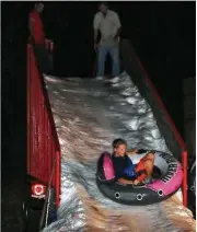  ?? City of Shenandoah ?? An ice slide is just one of the fun activities at the annual Lighting of the Angels event