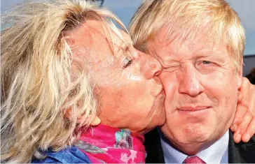  ??  ?? Embracing change: Boris Johnson is kissed by a well-wisher in sunny Dover yesterday, where he stopped off while campaignin­g to become the next leader of the Conservati­ves