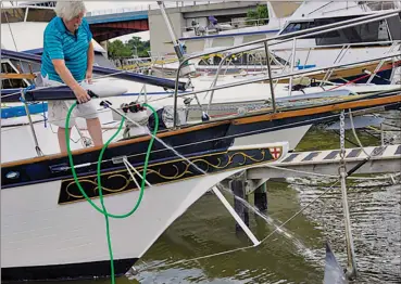  ??  ?? The bowsprit on my schooner, Britannia, made washing down the anchor to get underway a chore. The solution? An easy, handy DIY deck-wash system.
