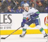  ?? Claus Andersen / Getty Images ?? The Vanouver Canucks’ Brock Boeser gets set to fire a shot against the Toronto Maple Leafs on Jan. 6 in Toronto.