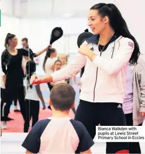  ??  ?? Bianca Walkden with pupils at Lewis Street Primary School in Eccles