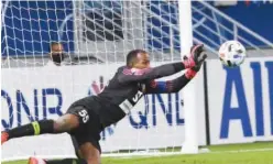  ??  ?? ↑
Goalkeeper Majed Nasser of Shabab Al Ahli Dubai makes a save against Pakhtakor during their AFC Champions League match on Sunday.