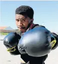  ??  ?? PACKING A MEAN PUNCH: Grade 11 pupil Sinethemba Mooi is a rising star in martial arts