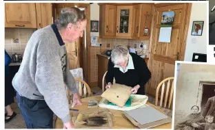  ??  ?? Tom Cullen and Molly Kavanagh showing pictures from Croghan/ Coolgreany Eviction.