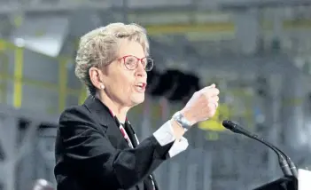  ?? THE CANADIAN PRESS FILES ?? Ontario Premier Kathleen Wynne speaks at the Ford Essex Engine Plant last month in Windsor, Ont. Wynne is calling for premiers to present a unified response to a new U.S. lumber tariff.