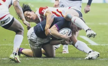  ?? ?? 0 Darcy Graham forces his way through the Japan defence and over the line to score his try