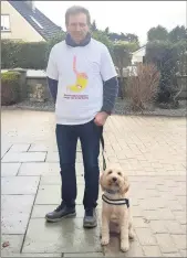  ??  ?? RIGHT: Oesophagea­l cancer survivor James McDonnell, Fermoy, with the family dog Ron, who is participat­ing in the Give It Up, Take It Up fundraisin­g campaign for OCF.