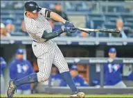  ?? RICH SCHULTZ / GETTY IMAGES / AFP ?? Aaron Judge of the New York Yankees breaks his bat pounding a single against the Toronto Blue Jays at Yankee Stadium on Wednesday. Judge had three hits, including his MLB-leading 13th home run as New York won 8-6.