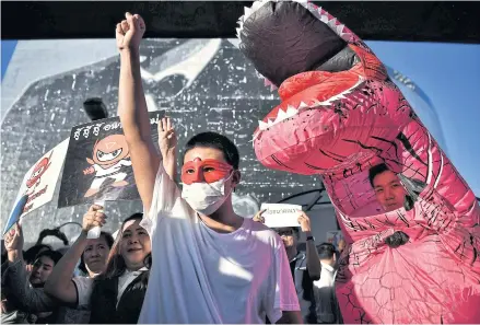  ?? AFP ?? Supporters of the Future Forward Party rally in Bangkok last month. The Constituti­onal Court rules on a dissolutio­n case against the party tomorrow.