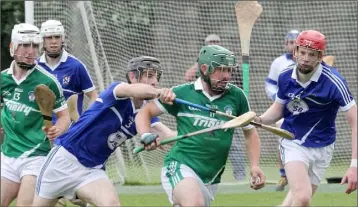  ??  ?? Alan Carton of Cloughbawn is closed down by Oylegate-Glenbrien duo Michael Heffernan and Mike Kelly in their Pettitt’s SHC clash in Bellefield on Saturday.