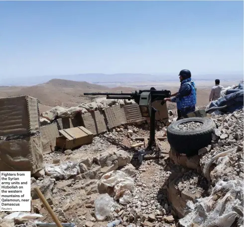  ?? Reuters ?? Fighters from the Syrian army units and Hizbollah on the western mountains of Qalamoun, near Damascus