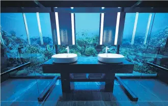  ?? PHOTOS: CONRAD MALDIVES RANGALI ISLAND ?? You may feel like you’re in a fishbowl in the suite’s bathroom.