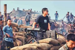  ??  ?? Hong Kong filmmaker Andrew Lau directs a war scene created for the upcoming film TheFoundin­gof anArmy.