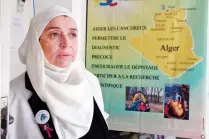  ??  ?? Samia Gasmi, the head of the ‘Nur Doha’ cancer charity, stands in a room of the associatio­n in the town of Ghardaia, some 600km south of Algiers. (AFP/file)