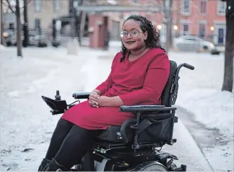  ?? PETER POWER THE CANADIAN PRESS ?? Sarah Jama, 23, a disability justice advocate who has cerebral palsy, poses for a portrait at her home in Hamilton on Tuesday.