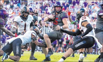  ?? Sam Hodde
The Associated Press ?? TCU quarterbac­k Max Duggan runs Saturday during the second overtime against Oklahoma State in Fort Worth, Texas. The No. 13 Horned Frogs won 43-40 but didn’t cover.