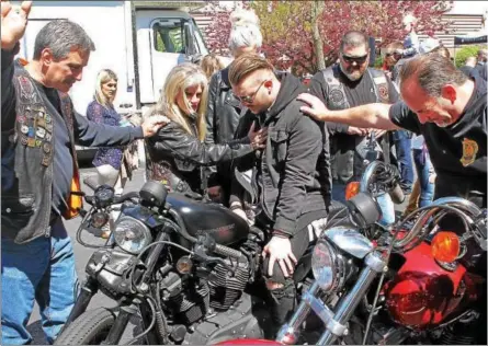  ?? CHRIS BARBER — DIGITAL FIRST MEDIA ?? Dot Smrke bestows a blessing on riders and their bikes on Sunday at the annual Blessing of the Bikes ceremony at the Power Place Church in Kennett Township.