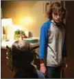  ?? ?? A serial child kidnapper called “The Grabber” (Ethan Hawke, back to camera) and his latest victim, 13-year-old Finney (Mason Thames), share a moment in Scott Derrickson’s “The Black Phone.”