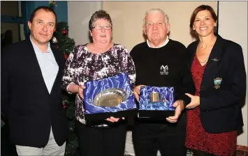  ??  ?? Bernie Furlong (Wexford), winner of the Solheim Cup, and Stan Parkinson who represente­d the rest of Ireland in the Men’s Captains’ Cup at the St. Helen’s awards presentati­ons with outgoing Captain Mick Conlon (left) and outgoing lady Captain Ann Byrne (right).