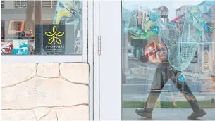  ?? BLOOMBERG ?? The Sand Dollar logo is seen outside a business in Nassau, Bahamas.