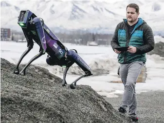  ?? MARC LESTER, ANCHORAGE DAILY NEWS ?? Alaska Department of Transporta­tion program manager Ryan Marlow demonstrat­es the robotic dog in Anchorage, Alaska.