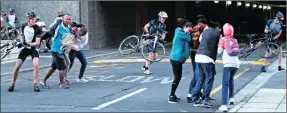  ?? Picture: IAN LANDSBERG ?? BLOWN AWAY: Gale-force winds at the starting point triggered the cancellati­on of the Cape Town Cycle Tour yesterday.