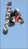  ?? AP PHOTO ?? Sebastien Toutant of Canada jumps during the men’s Big Air snowboard qualificat­ion competitio­n.