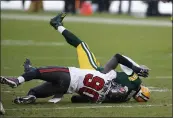  ?? MATT LUDTKE — THE ASSOCIATED PRESS ?? The Buccaneers’ Jason Pierre-Paul sacks Packers quarterbac­k Aaron Rodgers during the first half of the NFC championsh­ip game in Green Bay, Wis., on Sunday.