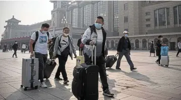  ?? ?? Bouncing back: Travellers arriving at Beijing Station. China’s economic recovery continues with a pickup in car and homes sales this month in the biggest cities compensati­ng for weaker global demand and business confidence. — Bloomberg