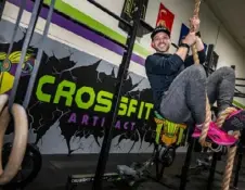  ?? Lucy Schaly/Post-Gazette ?? Micah Price owns his own CrossFit gym and is a part-time realtor. He’s able to earn commission­s because he maintains an active license, but it’s mostly a side gig, something he does for family and friends.
