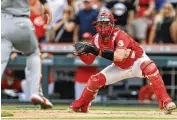  ?? AARON DOSTER / ASSOCIATED PRESS ?? Cincinnati Reds catcher Tyler Stephenson waits to tag out Joey Bart of the San Francisco Giants to end the game Saturday in Cincinnati. The Reds won 3-2.