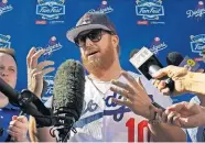  ??  ?? Justin Turner is interviewe­d by reporters during Dodger Stadium FanFest in Los Angeles in this Jan. 25, 2020, file photo. [AP PHOTO/MARK J. TERRILL, FILE]